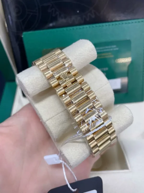 mmexport1773577106298 Rolex Day-Date 40mm 18K Yellow Gold Baguette Diamond Bezel President Bracelet Automatic Watch